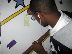 Painting a mural at the youth center