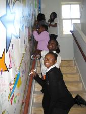 Painting a mural at the youth center